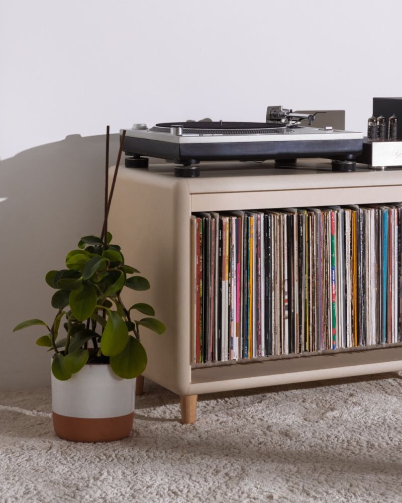 Tilt module in White Pearl on feet, filled with records, shown as the Alton composition, turntable on top — Groovaly