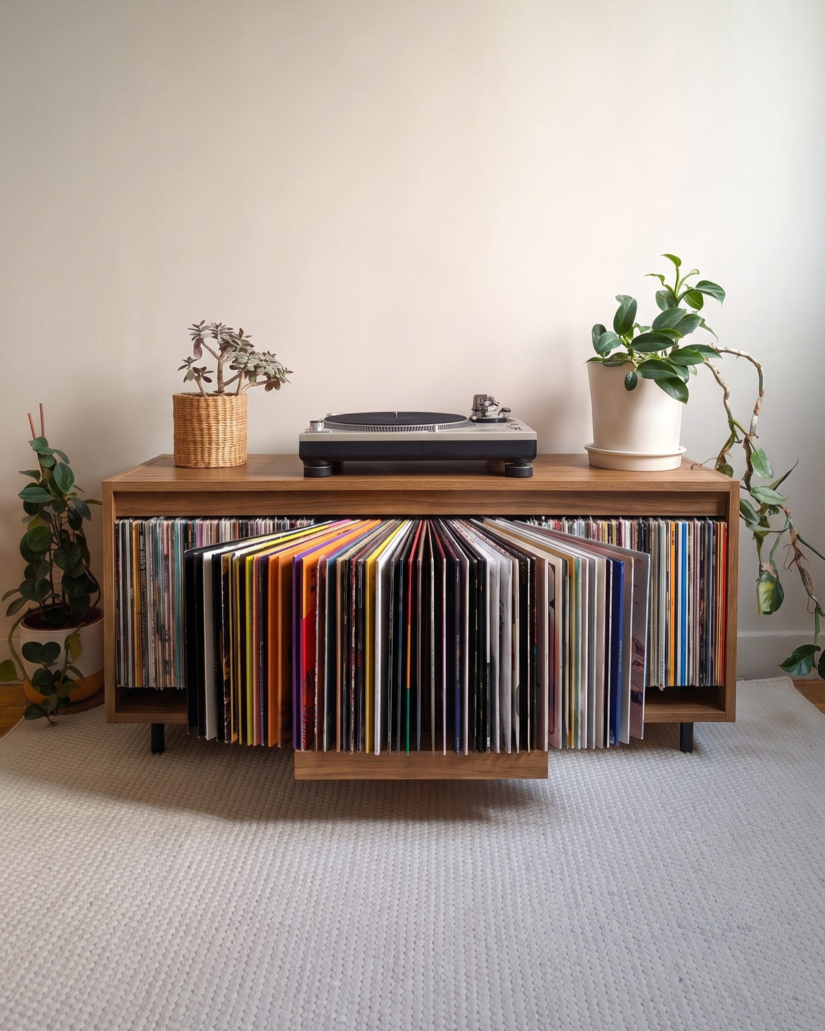 A single Bloom Console with a walnut finish, records fanned open in the Bloom drawer, turntable on top — Groovaly