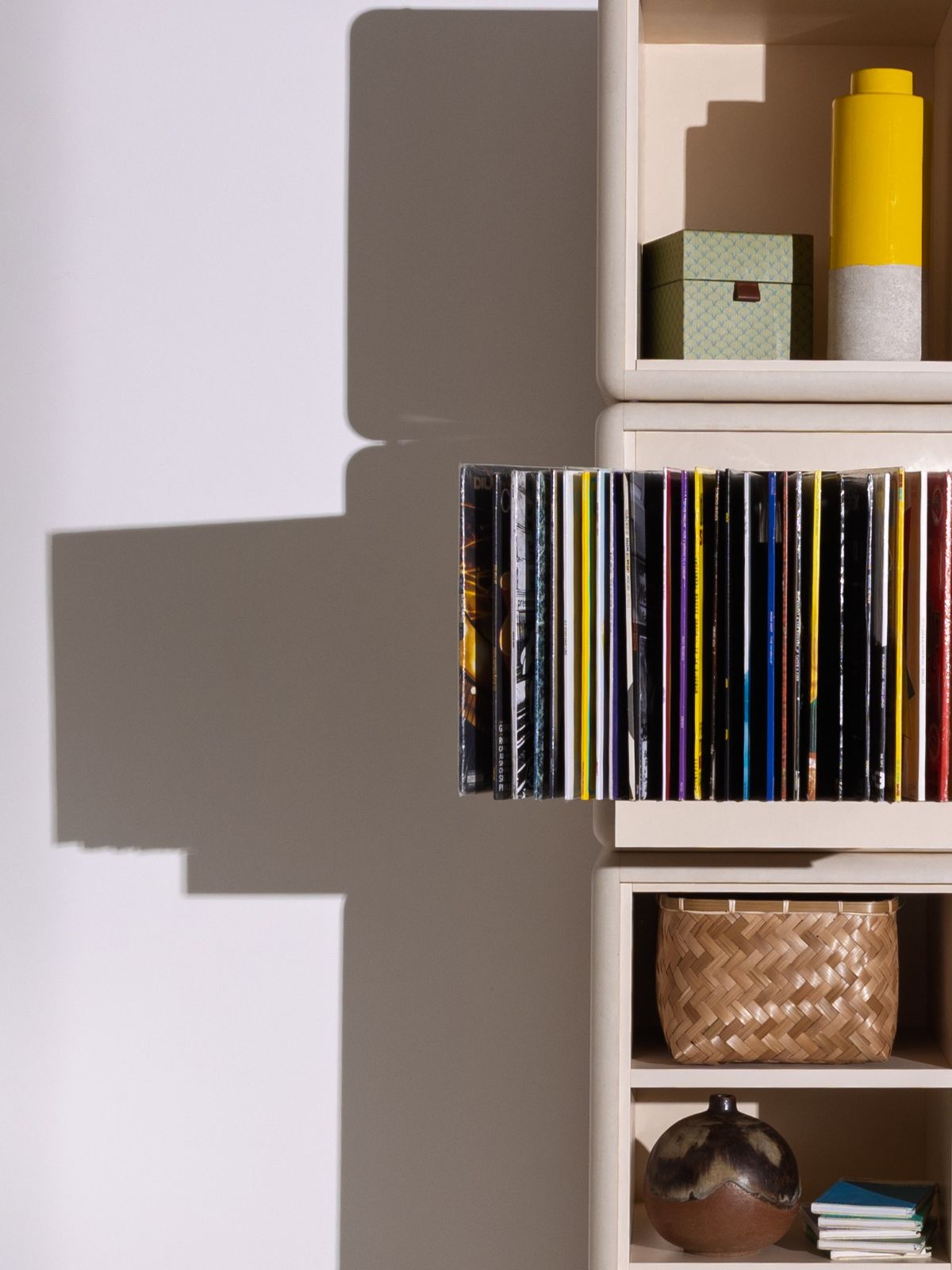 A Bloom fan-drawer open with records fanned out, built into Lou — Groovaly