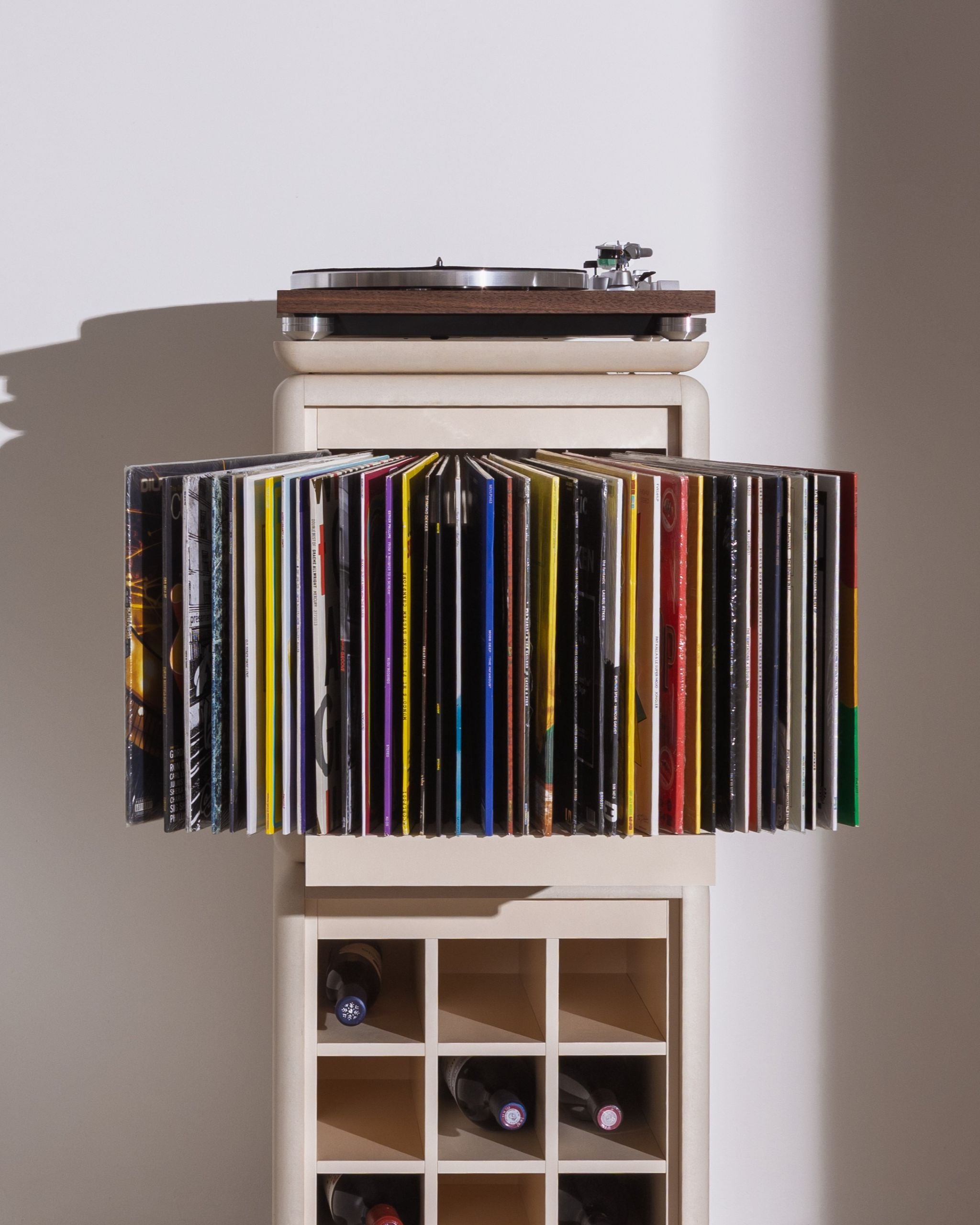 Bloom module in White Pearl, drawer open, records fanned out to show their covers, as part of the Sly vinyl furniture — Groovaly