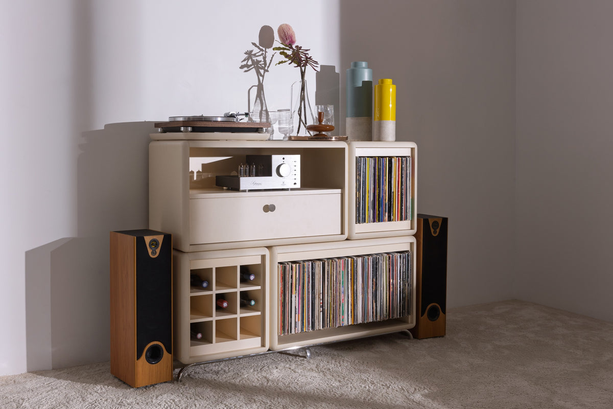 Curtis in White Pearl, turntable and amp on top, records and bottles below, in a corner setting — Groovaly