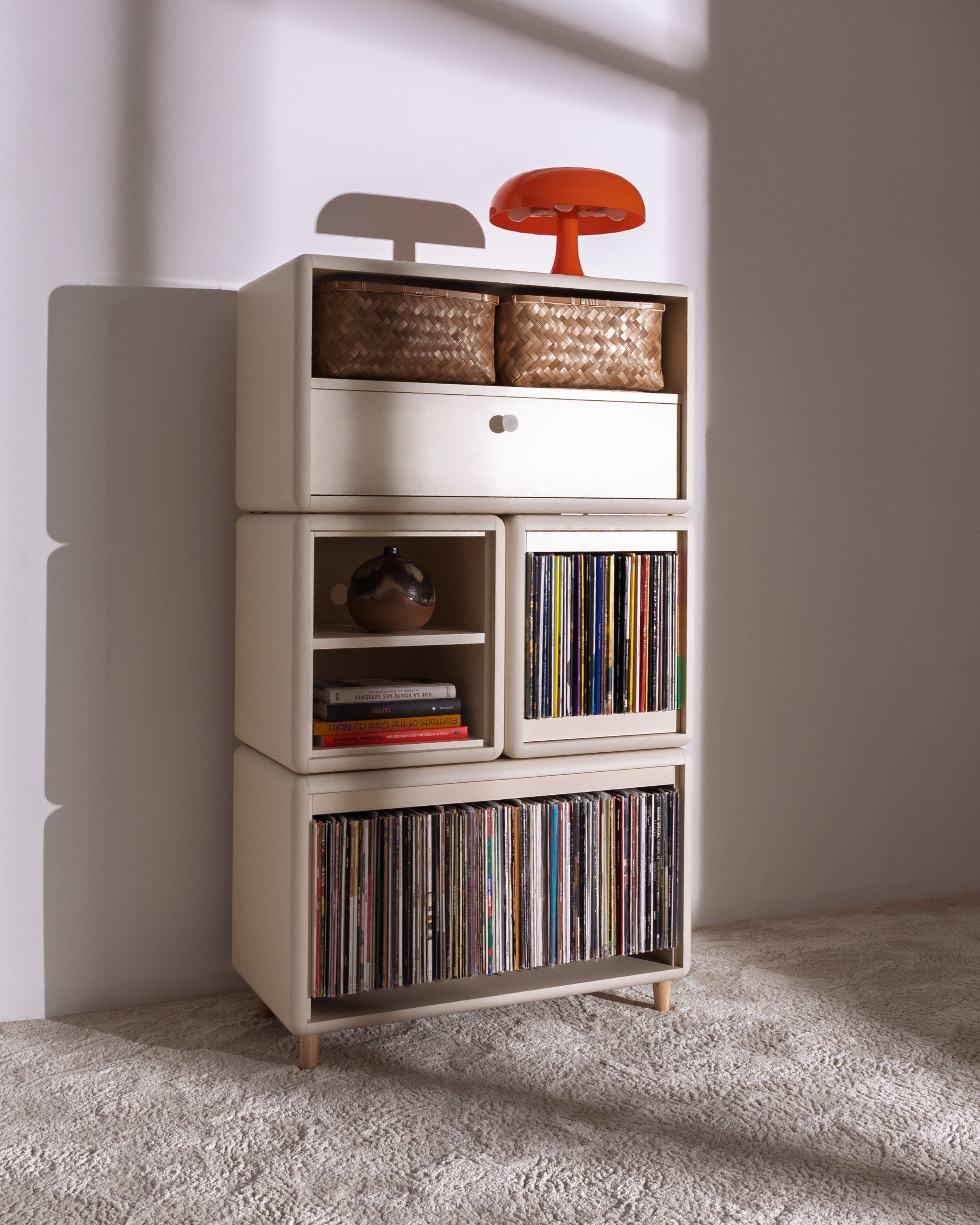 James in White Pearl in a room, full of records with baskets and a lamp on top, the Bloom drawer closed — Groovaly