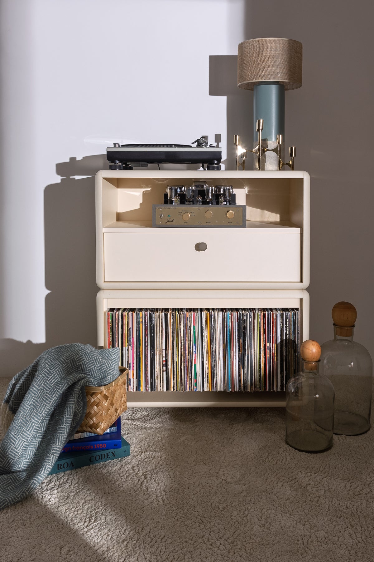 Maceo in White Pearl in a styled room, turntable and amp on the Chest, records in the Tilt below — Groovaly