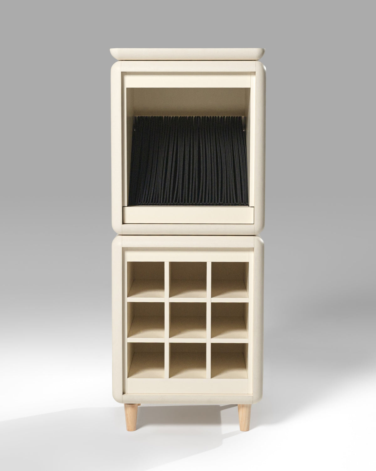 Sly in White Pearl from the front, black sleeves in the Bloom drawer above the Grid — Groovaly