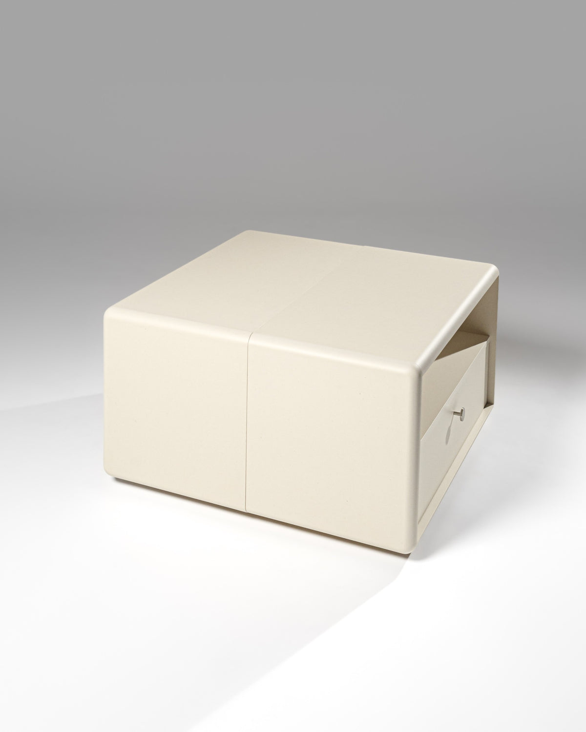Thelonious vinyl furniture in White Pearl, three-quarter view of the Chest side, back-to-back with the Tilt — Groovaly