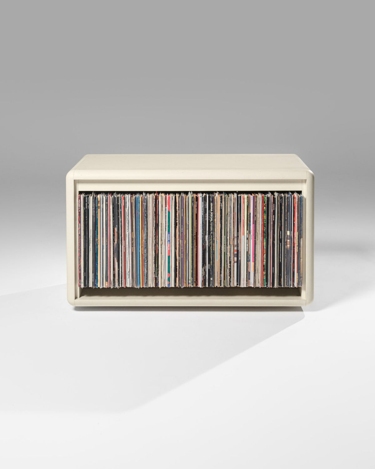 Tilt wide vinyl module in White Pearl, front view, filled with records — Groovaly