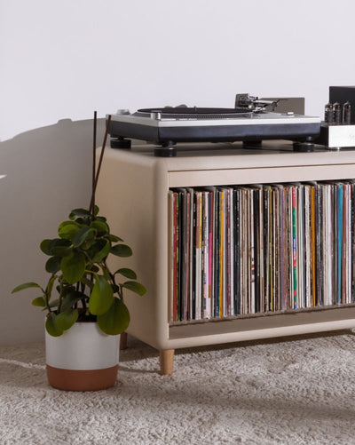 Tilt module in White Pearl on feet, filled with records, shown as the Alton composition, turntable on top — Groovaly