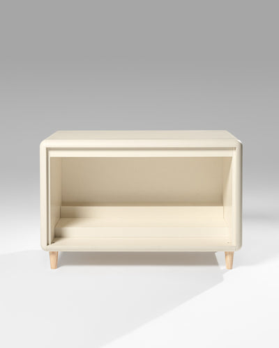 Alton in White Pearl — a Tilt module on feet — shown empty against a studio background — Groovaly