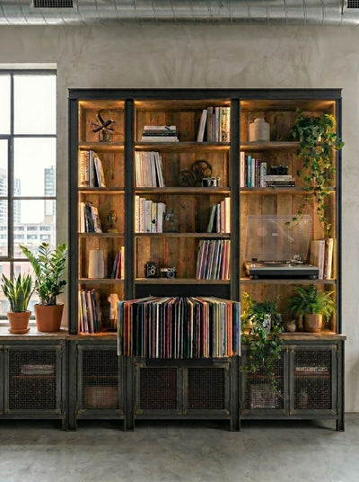 A Bloom fan-drawer built into a tall industrial-style bookcase, records fanned out, in a loft — Groovaly