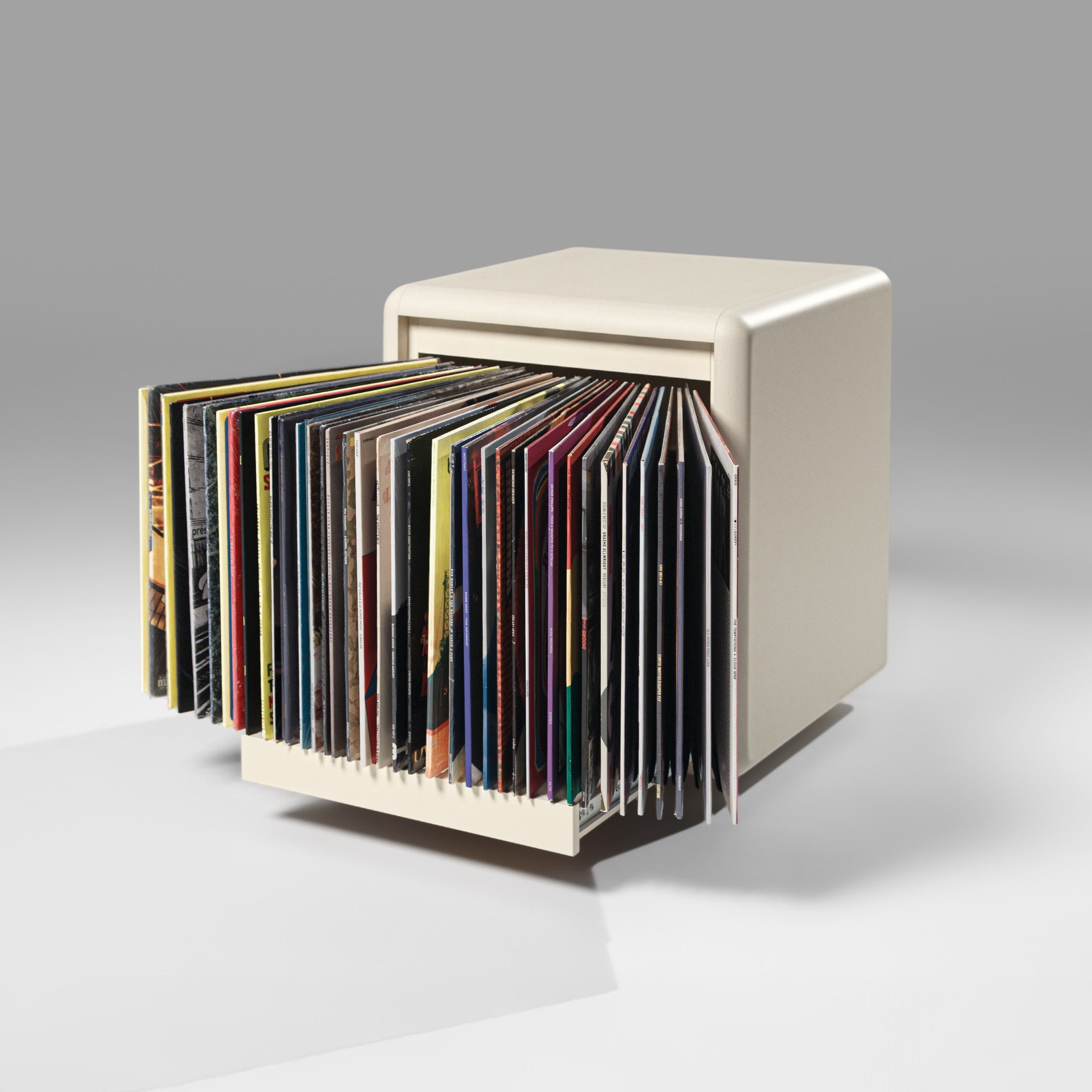 The Bloom module in White Pearl, drawer open with records fanned out to show their covers — Groovaly