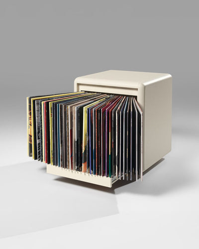 Bloom vinyl module in White Pearl, three-quarter view, drawer open, records fanned out to show their covers — Groovaly