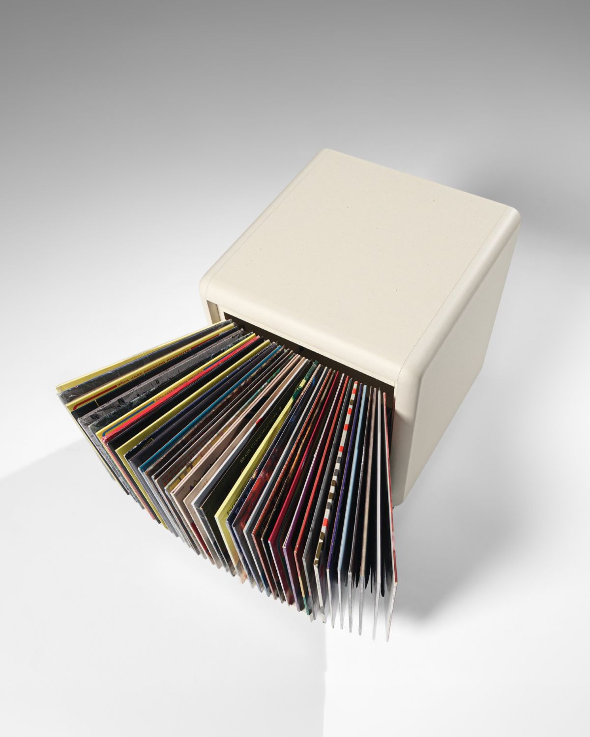 Bloom vinyl module in White Pearl seen from above, drawer open with records fanned into an arc — Groovaly