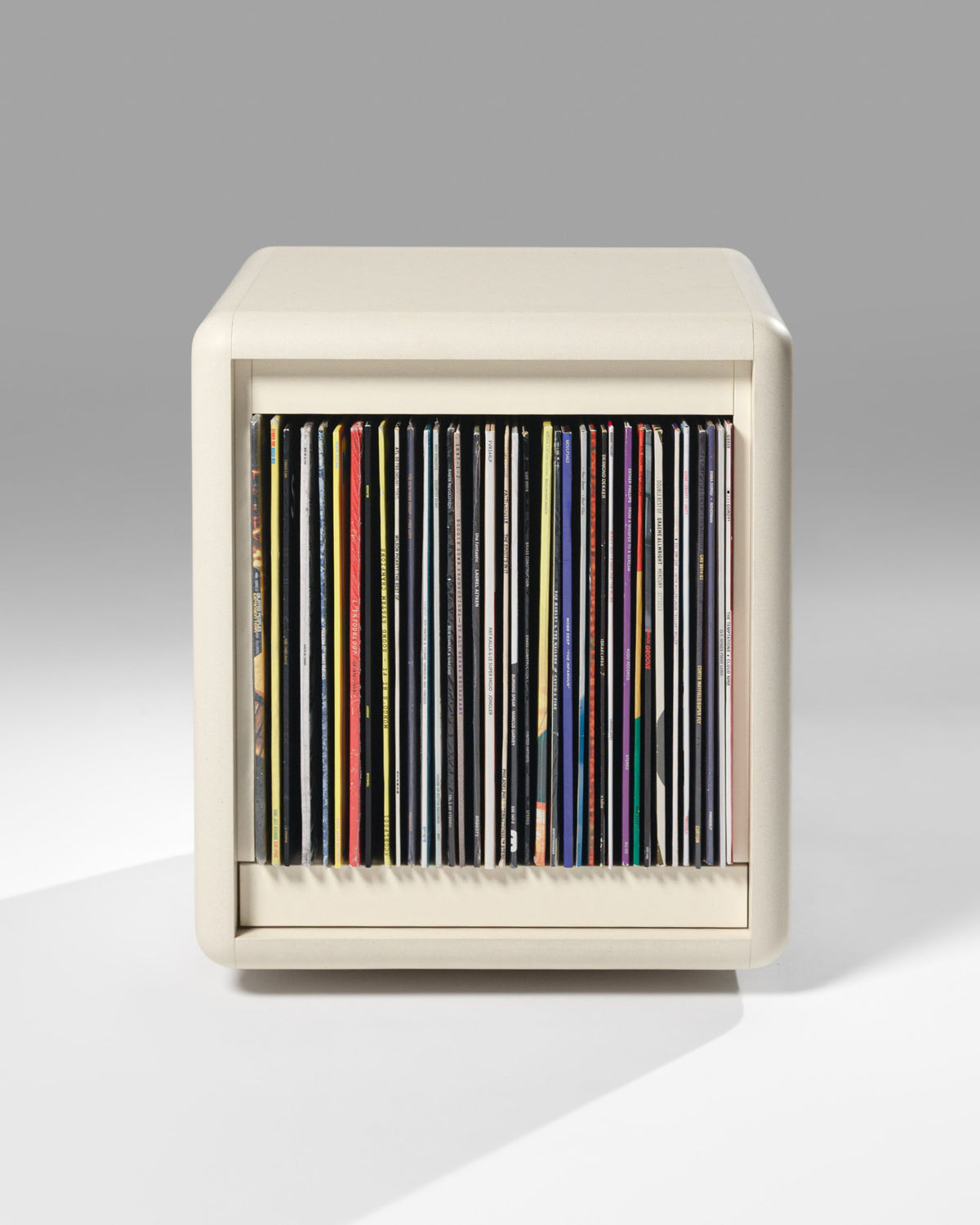 Bloom vinyl module in White Pearl, front view, filled with records, drawer closed — Groovaly