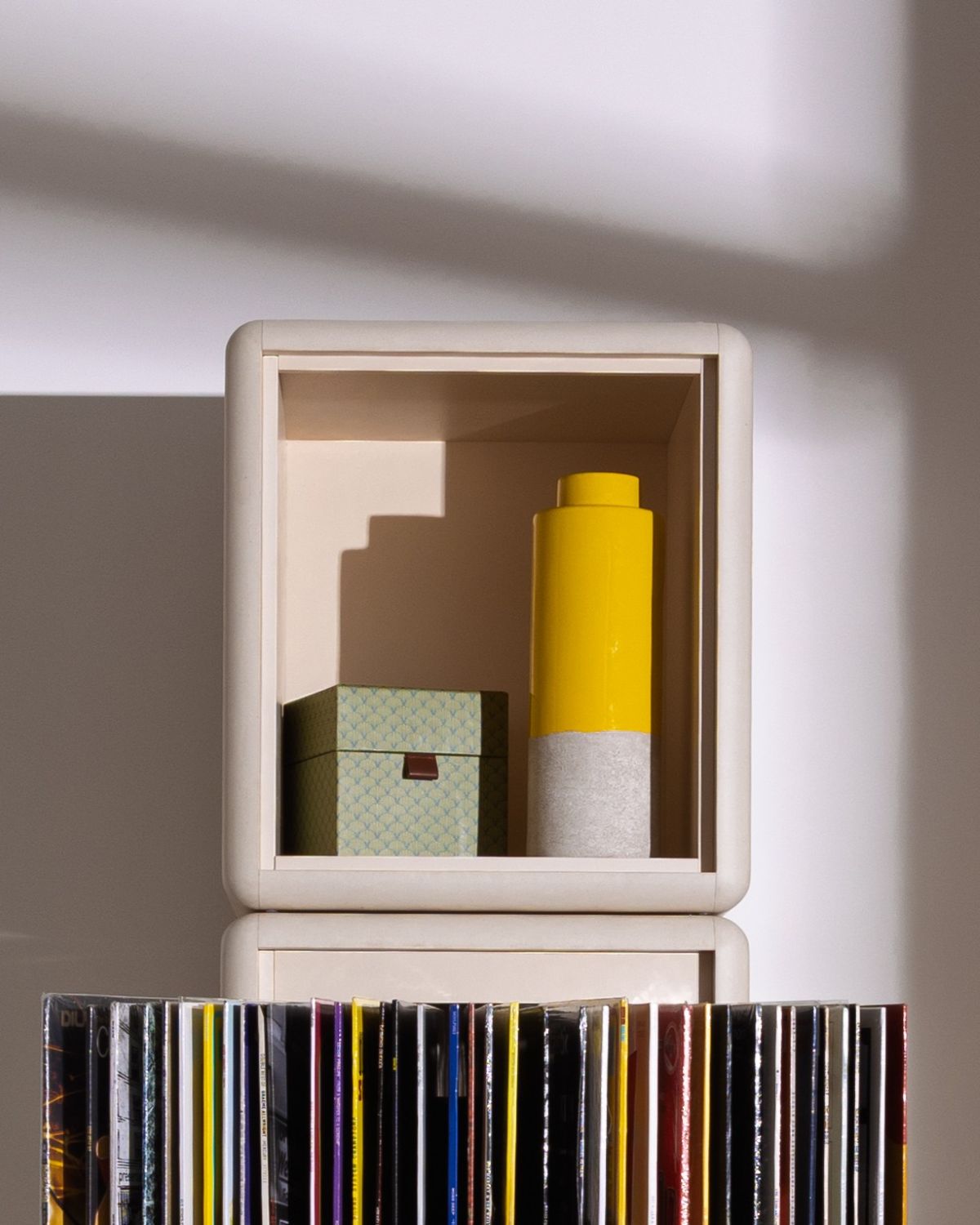 Cub module in White Pearl holding objects, stacked on a Bloom module with its fan-drawer open — Groovaly