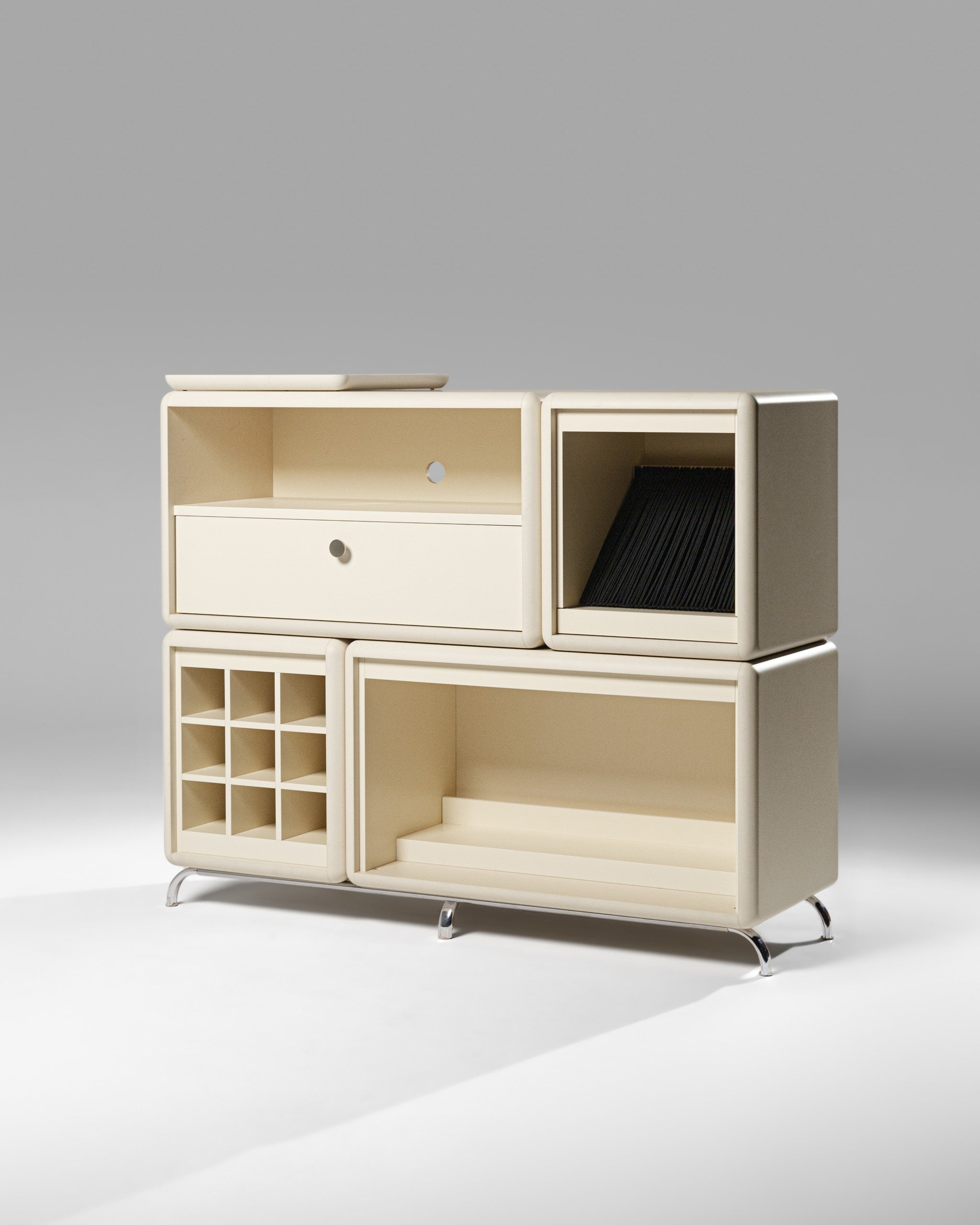 Curtis vinyl furniture in White Pearl, three-quarter studio view of the five-module composition — Groovaly