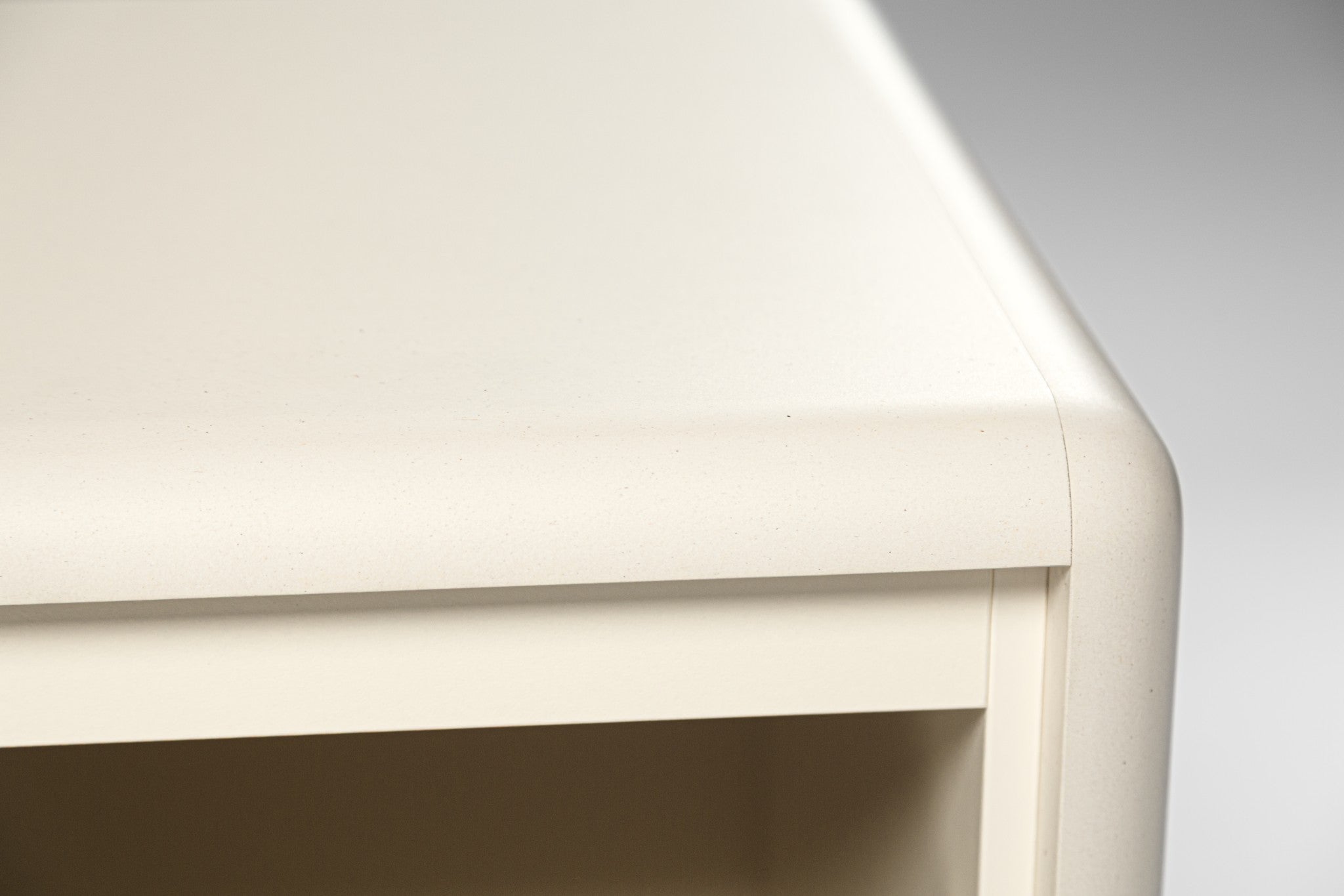 Close detail of a rounded corner in matt White Pearl Valchromat — Groovaly