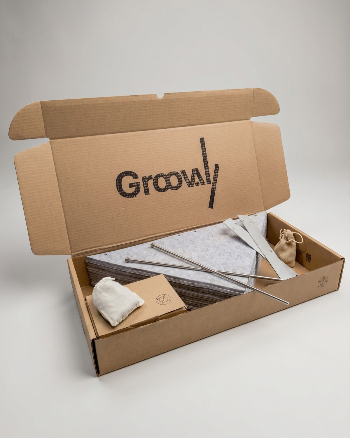 The Bloom Kit in its box: grey felt sleeves, steel rods and fittings — Groovaly