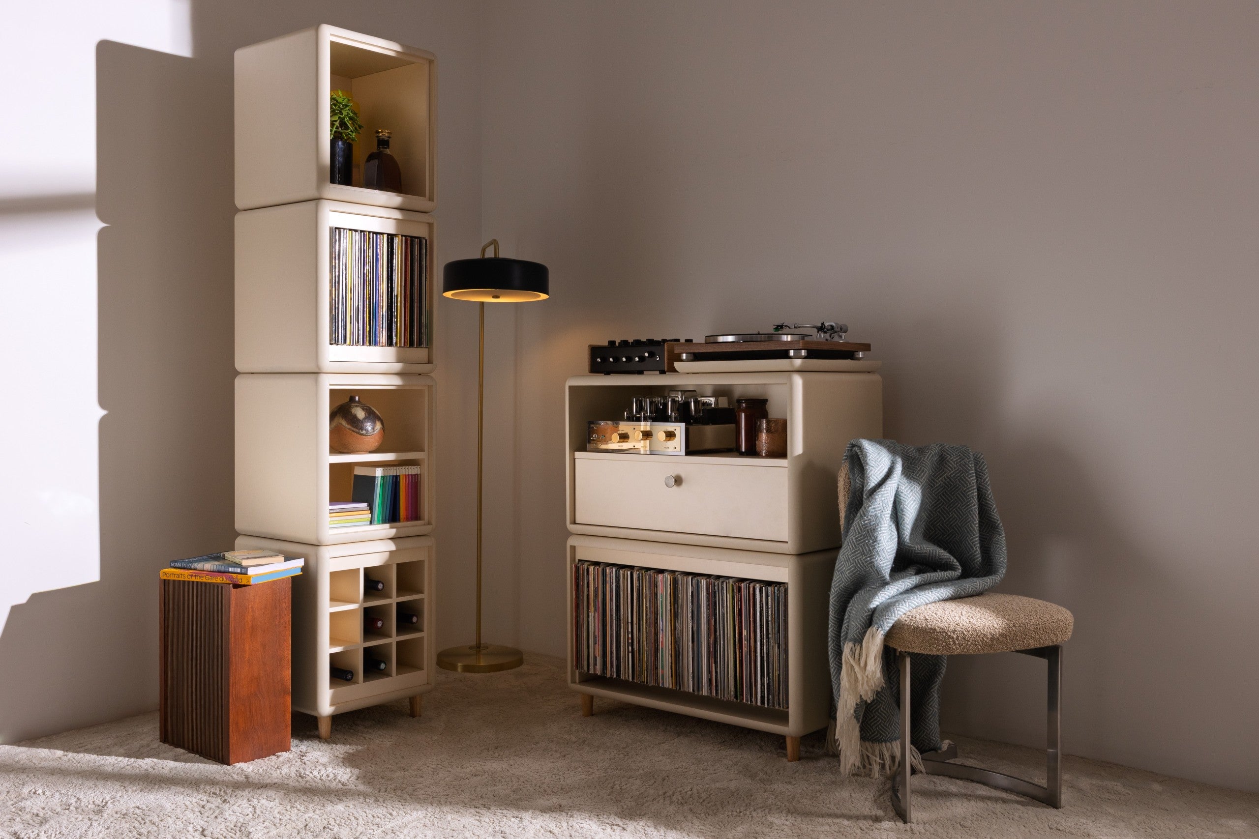 A Golden Age setup in White Pearl: the Lou tower and Maceo, records and turntable in a warm living room — Groovaly