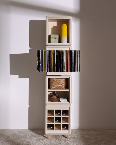 Lou in White Pearl: a tall four-module tower, records fanned in Bloom and bottles in the Grid below — Groovaly