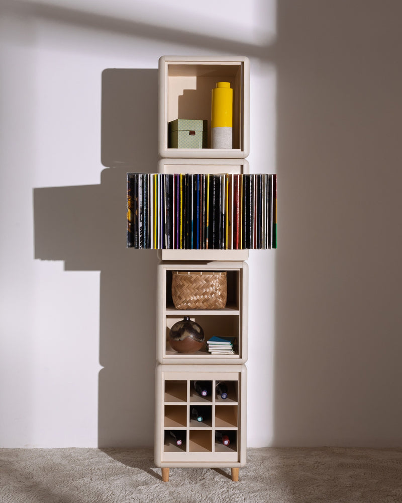 Lou in White Pearl: a tall four-module tower, records fanned in Bloom and bottles in the Grid below — Groovaly