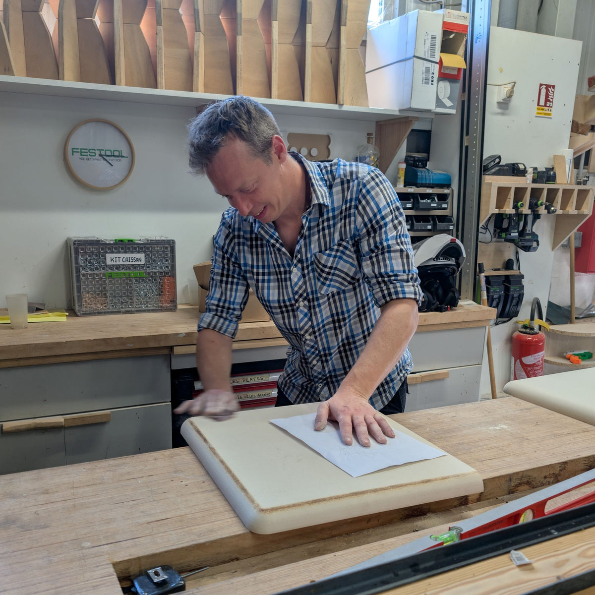 Sanding a Golden Age piece by hand in the workshop — Groovaly