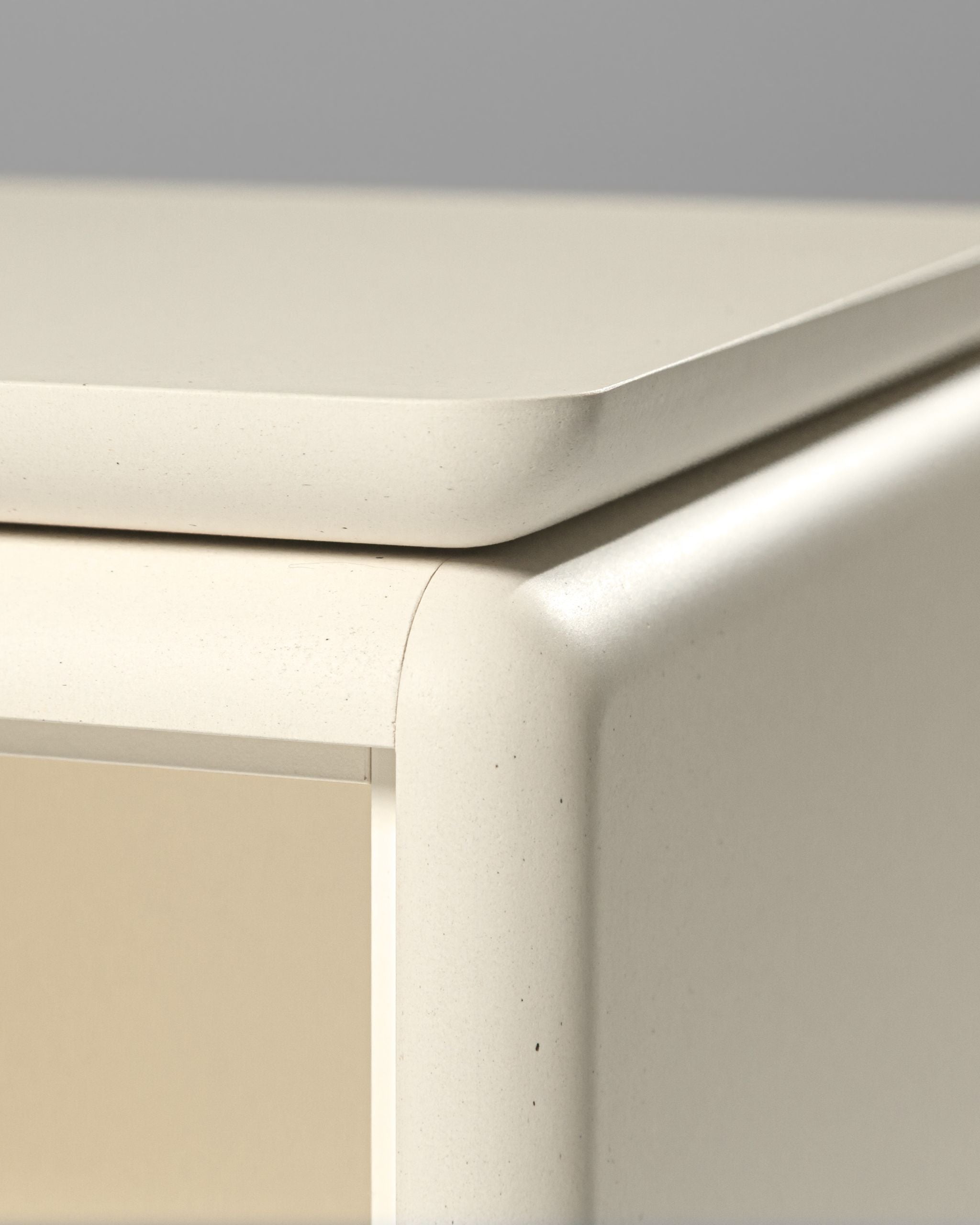 Close-up of the Nest platform in White Pearl resting on the module below, showing the rounded edges and matt surface — Groovaly