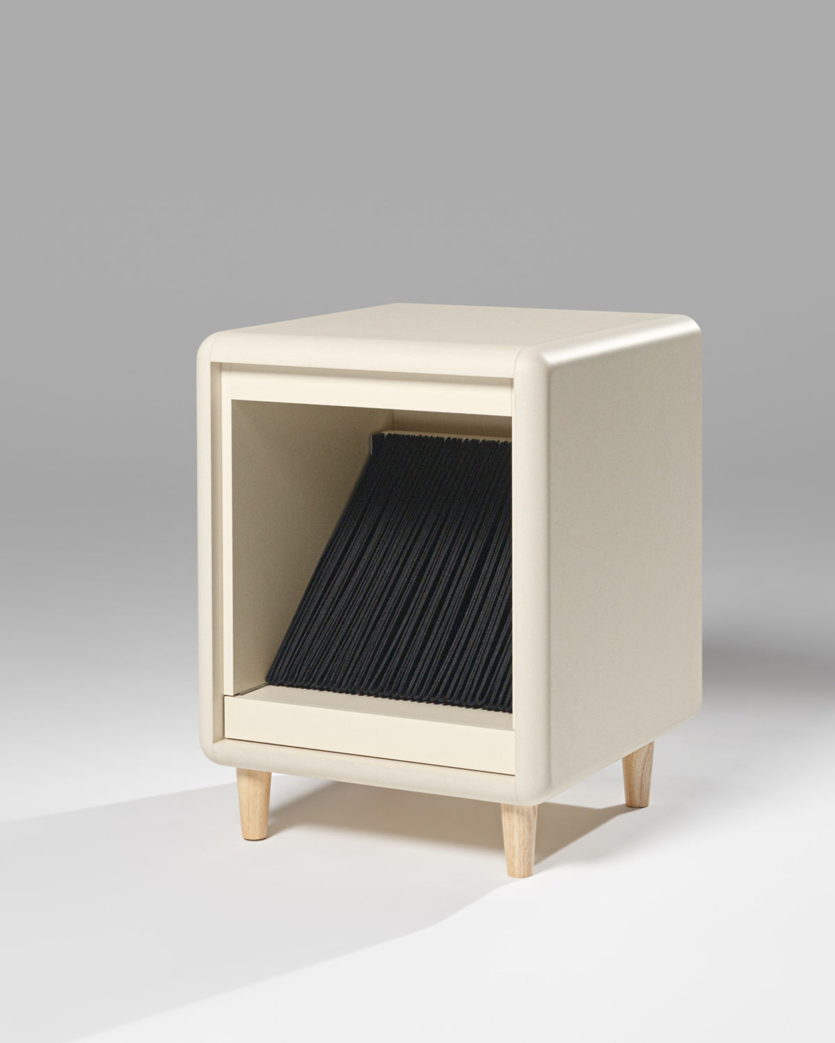 Otis vinyl furniture in White Pearl on wooden feet, three-quarter view, showing the empty felt sleeves inside — Groovaly