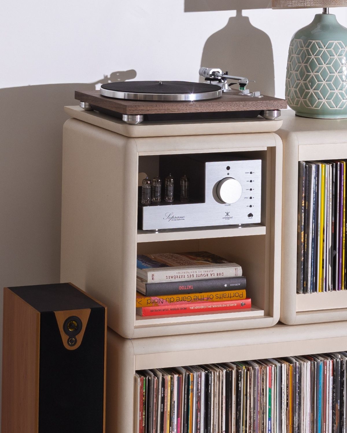 Split in White Pearl holding an amplifier and books, shown as part of Patti — Groovaly