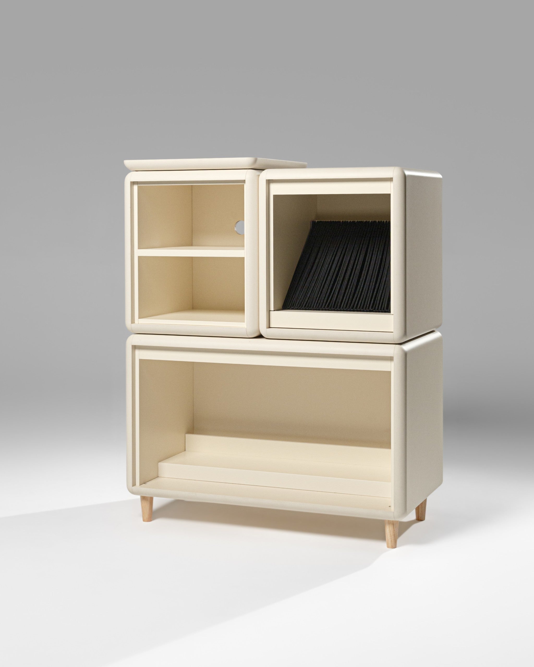 Patti in White Pearl shown empty in studio on feet, its modules stacked above a Tilt base — Groovaly