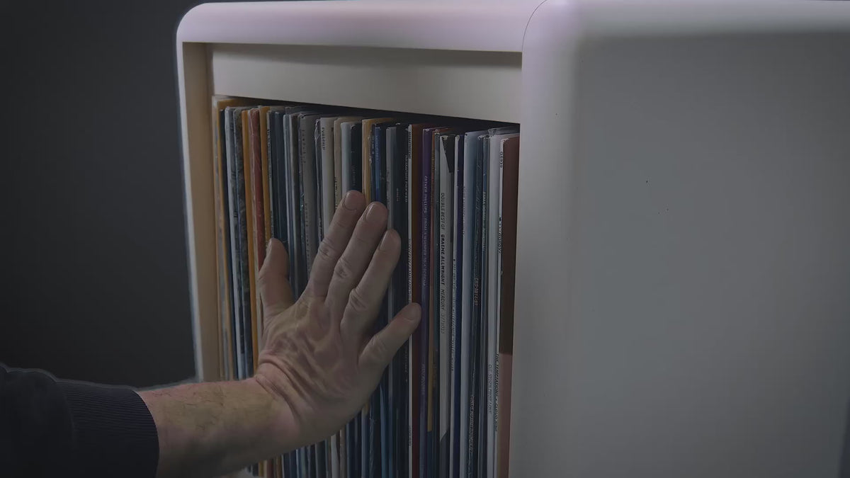 A Bloom fan-drawer opening, record covers fanning open into an arc to reveal them all at once — Groovaly.