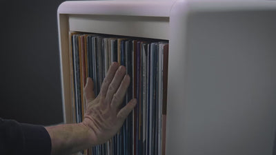 A Bloom fan-drawer opening, record covers fanning open into an arc to reveal them all at once — Groovaly.