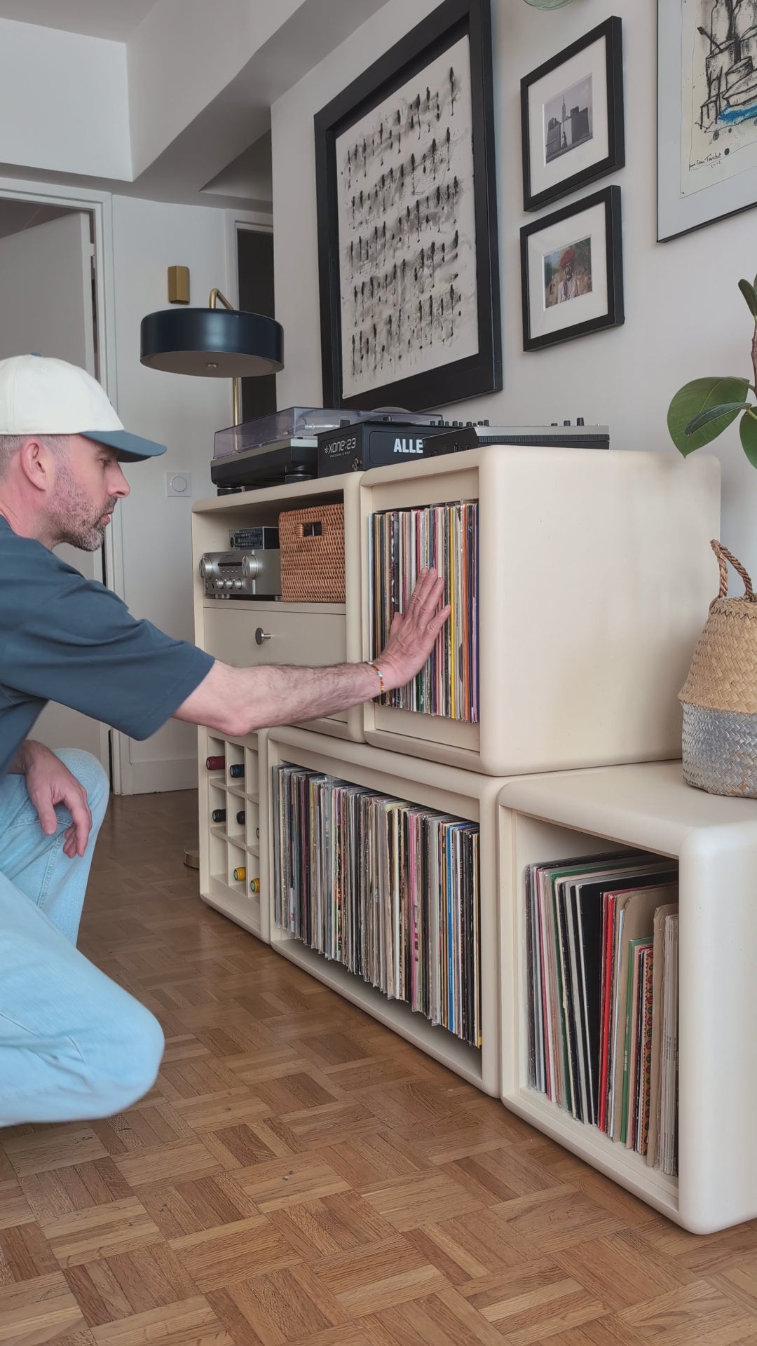 Load video: Browsing records in Groovaly furniture — covers fanned open in a Bloom drawer, then a sleeve tipped forward and lifted out — Groovaly