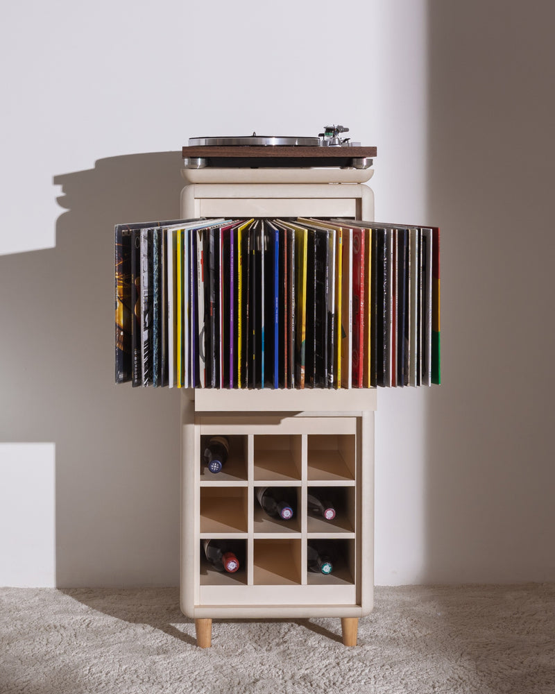 Sly in White Pearl, records fanned in the Bloom drawer, turntable on top and bottles in the Grid below — Groovaly