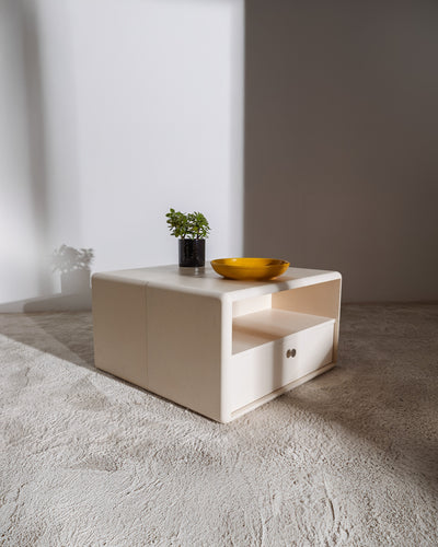 Thelonious vinyl furniture in White Pearl used as a low table, the Chest side with an open compartment — Groovaly