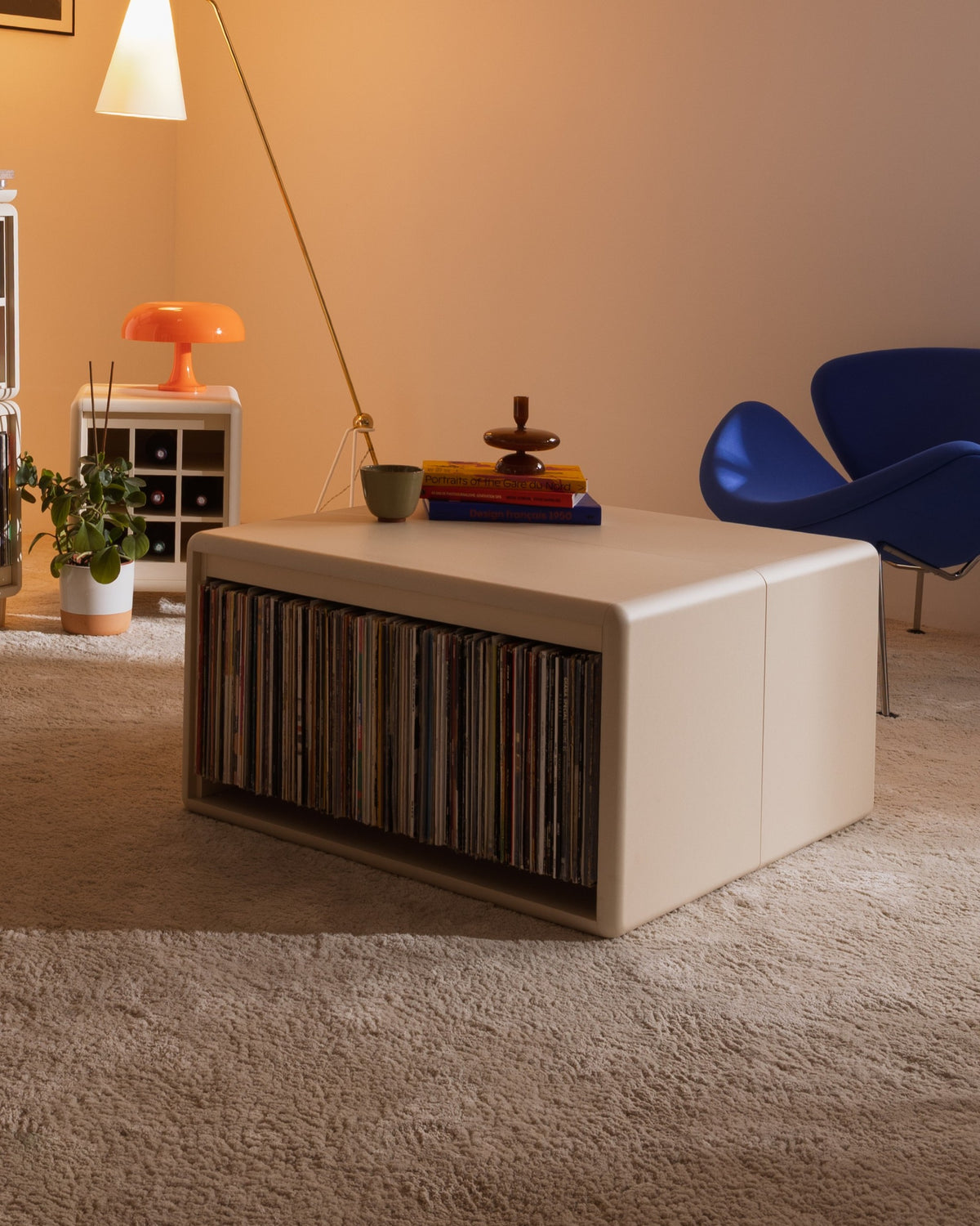 Thelonious vinyl furniture in White Pearl used as a low table, records on the Tilt side, books and objects on top — Groovaly