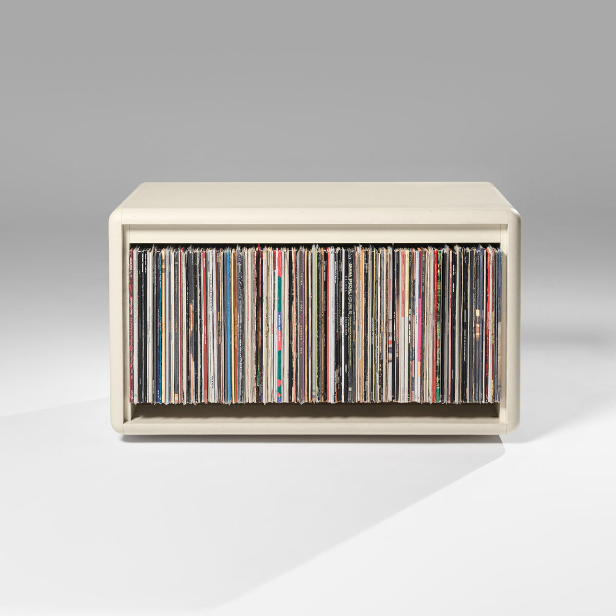 The Tilt module in White Pearl, filled with records in its wide open bay — Groovaly