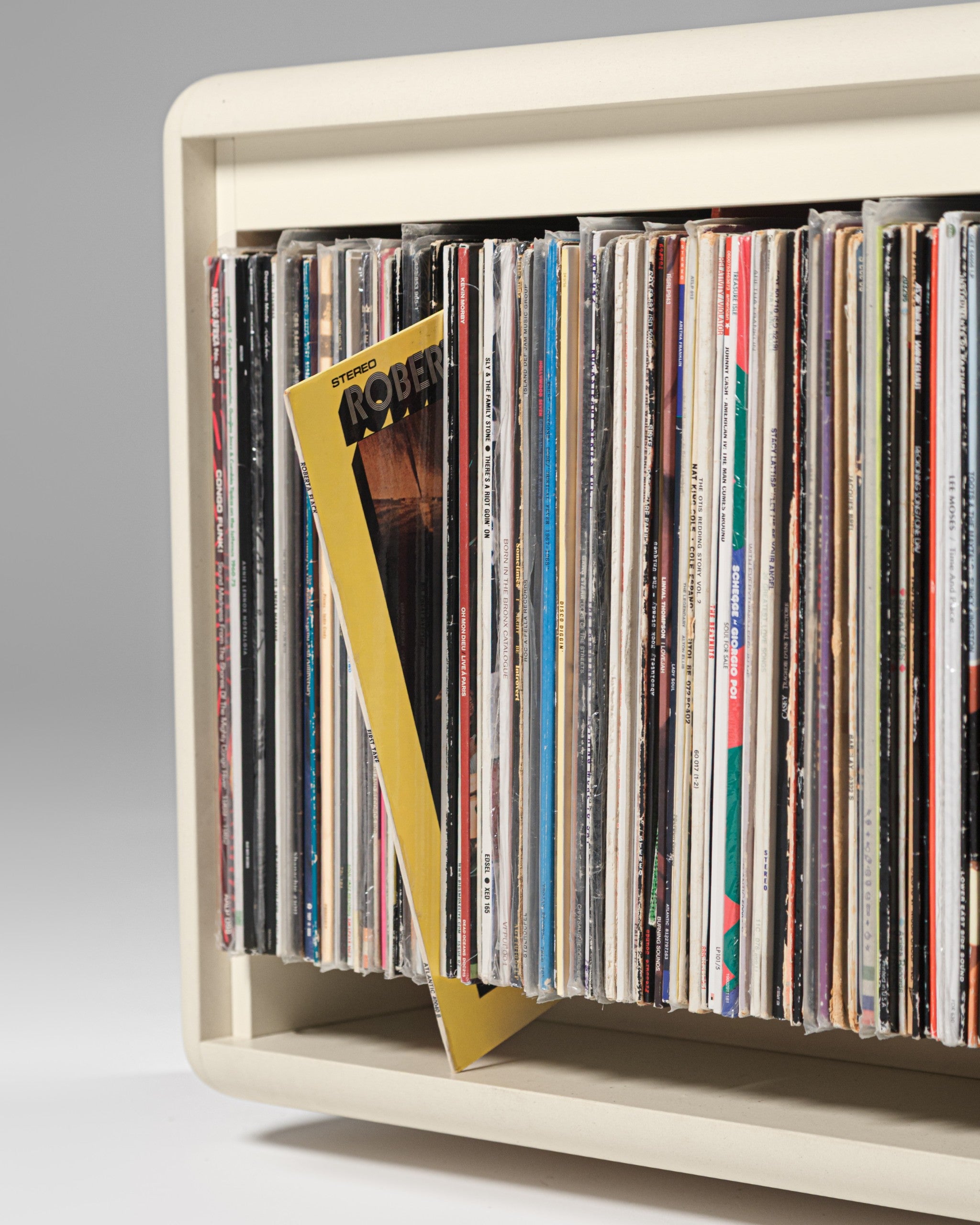 A record tipped forward in a Tilt bay after a press on its top edge, cover shown in place — Groovaly