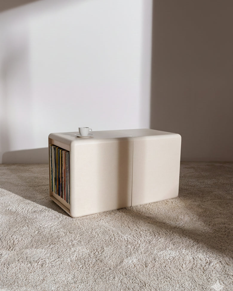 Tina in White Pearl on the floor, the closed Bloom drawer holding records beside the Grid — Groovaly