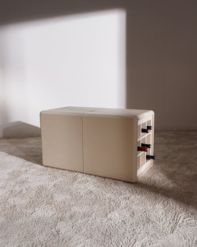 Tina in White Pearl, bottles in the Grid beside the closed Bloom drawer — Groovaly